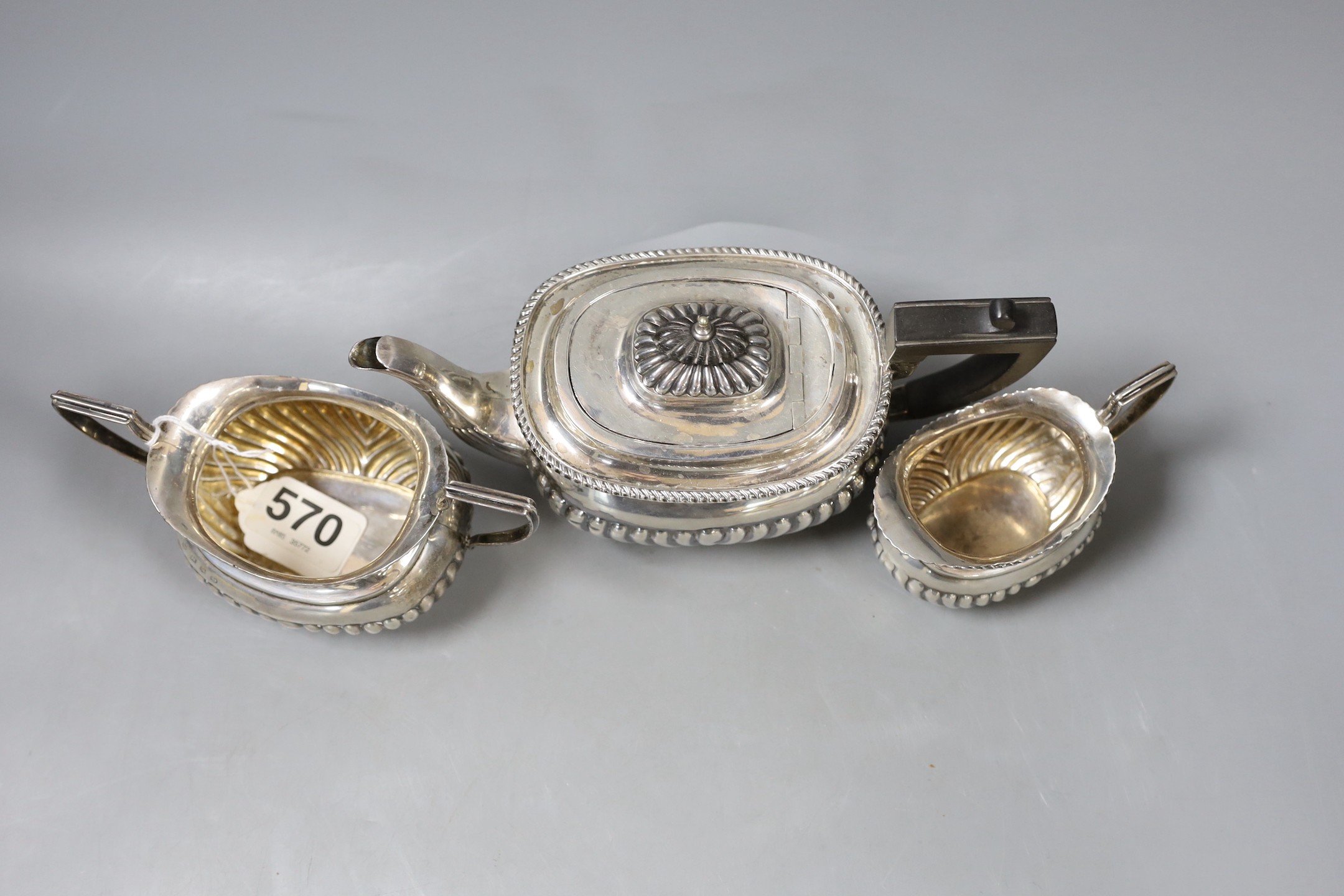 A matched late Victorian demi-fluted silver three piece tea set, Birmingham, 1896/7